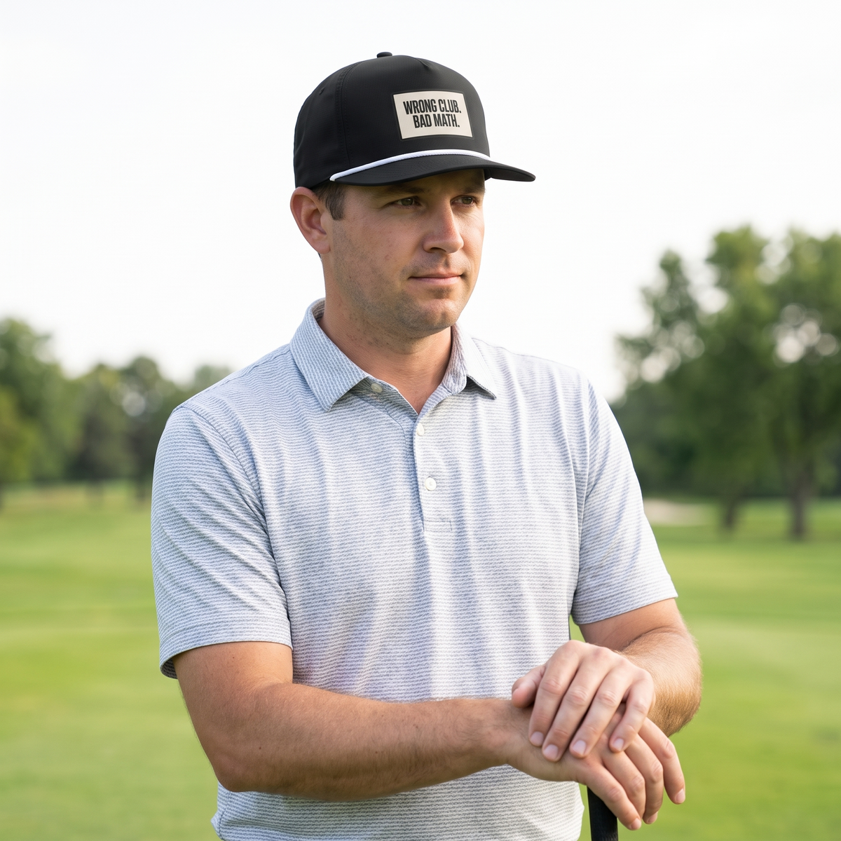 A golfer on a golf course wearing the Wrong Club. Bad Math. rope hat in Black with a white rope.