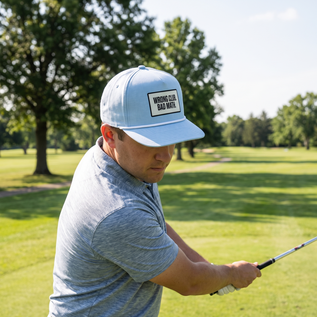 A golfer on a golf course wearing the Wrong Club. Bad Math. rope hat in Chambray with a white rope.